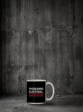 Mug Programme électoral posé sur sol béton