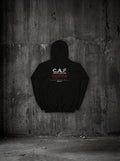 Hoodie C.A.F SURVIVORRR, vue dos sur mur béton