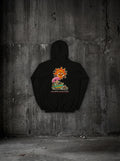 Hoodie La planète a 40 de fièvre noir, dos, sur mur béton